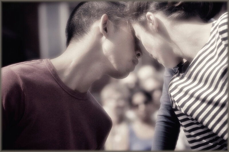 Two People Touching Foreheads