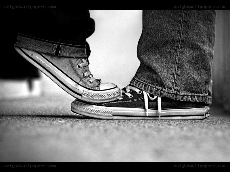 two people touching shoes