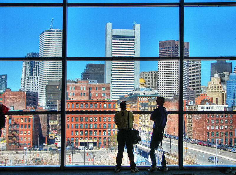 Two people viewing city skyline