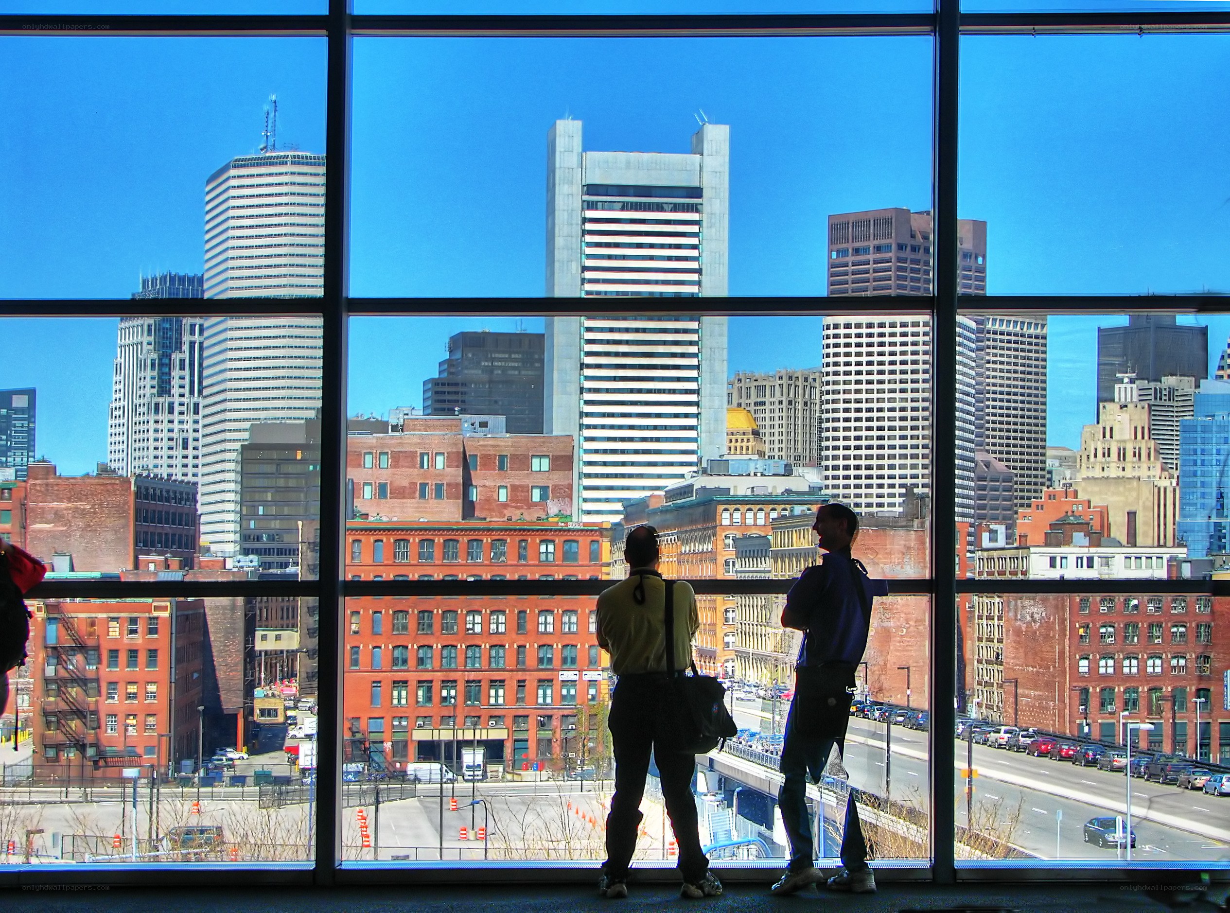Two people viewing city skyline