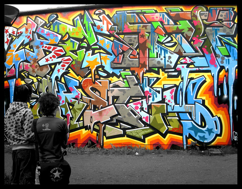 Two People Viewing Graffiti