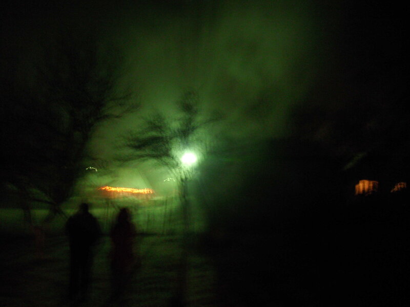 Two People Walking at Night