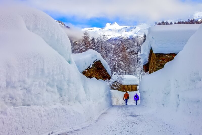 Two People Walking in Snow — White, Serene, Winter