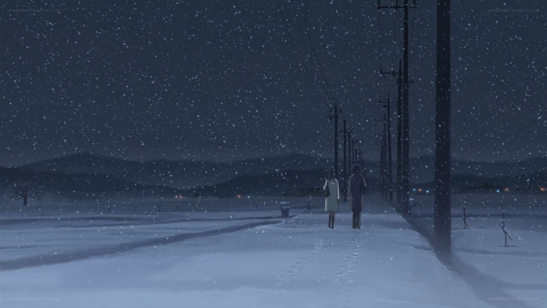 two people walking in snow