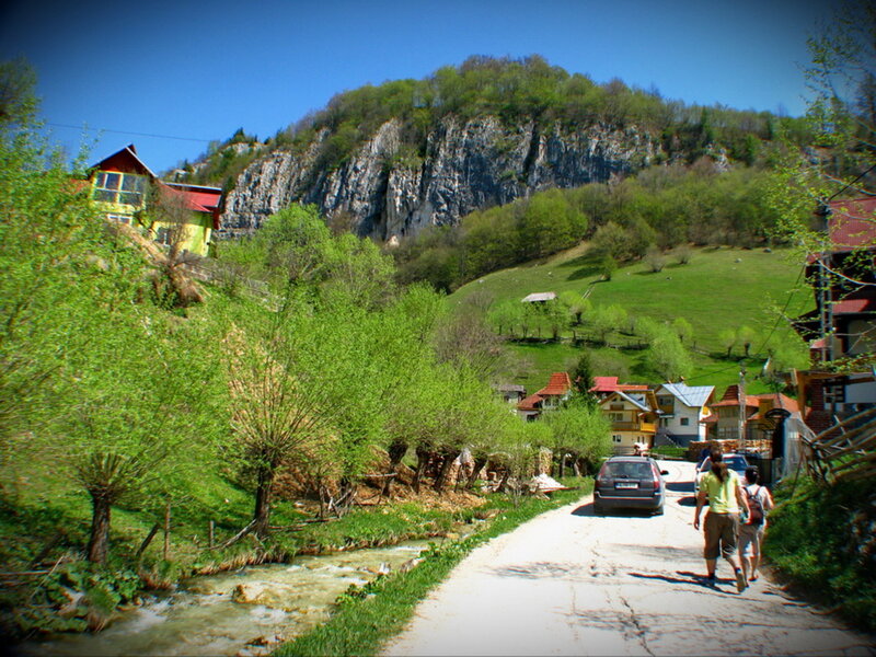 Two People Walking on Road — Green