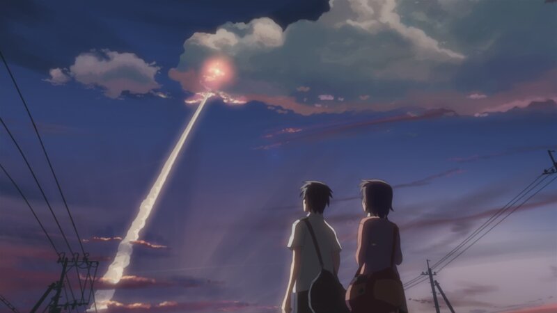two people watching a meteor