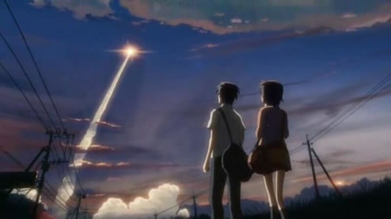 Two people watching a shooting star