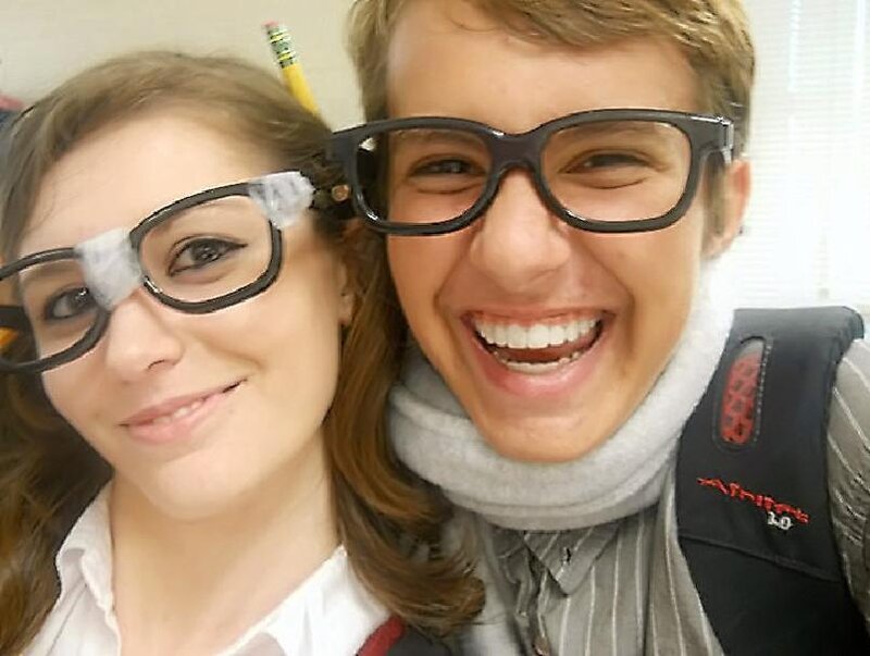 Two People Wearing Glasses