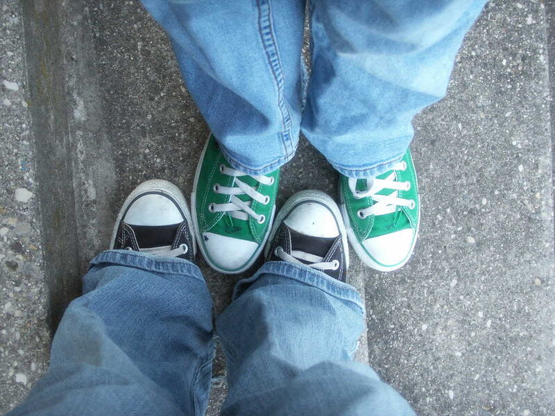 Two People Wearing Sneakers