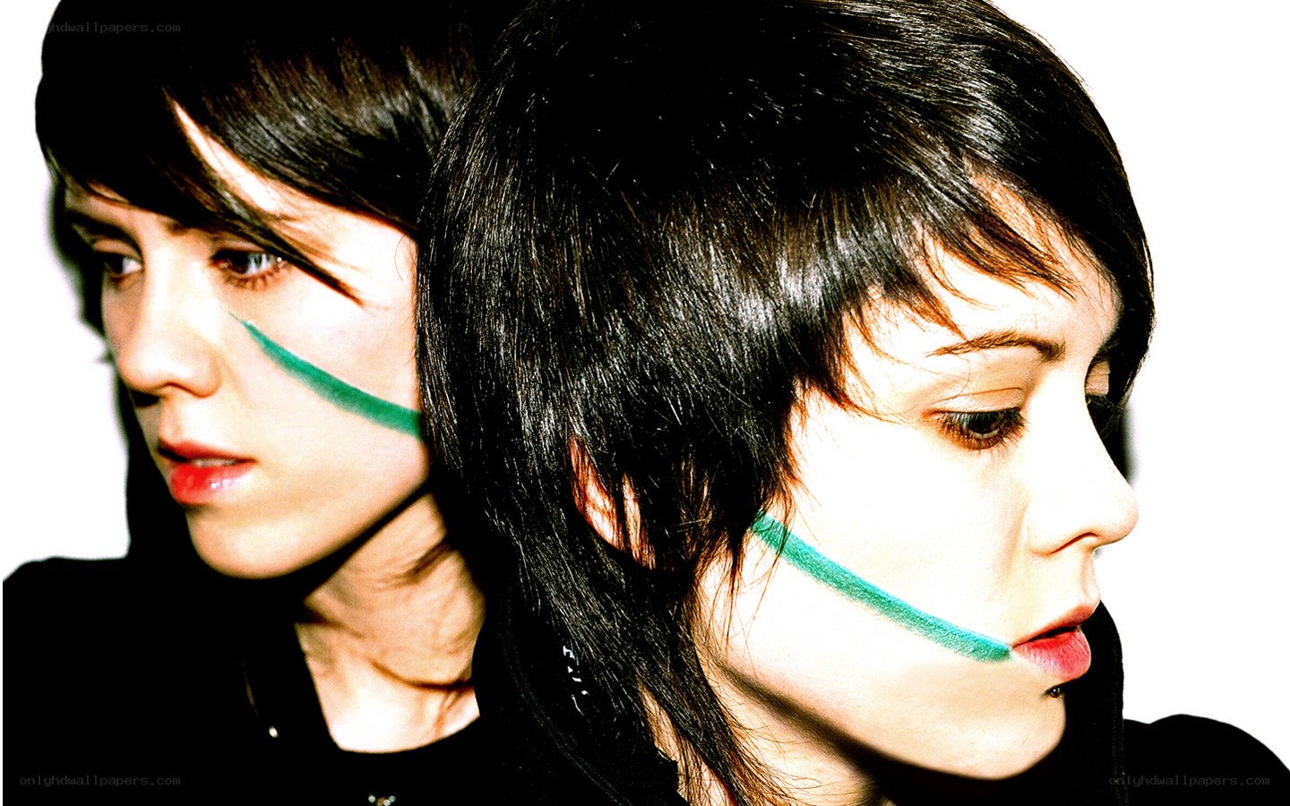 two people with green face paint