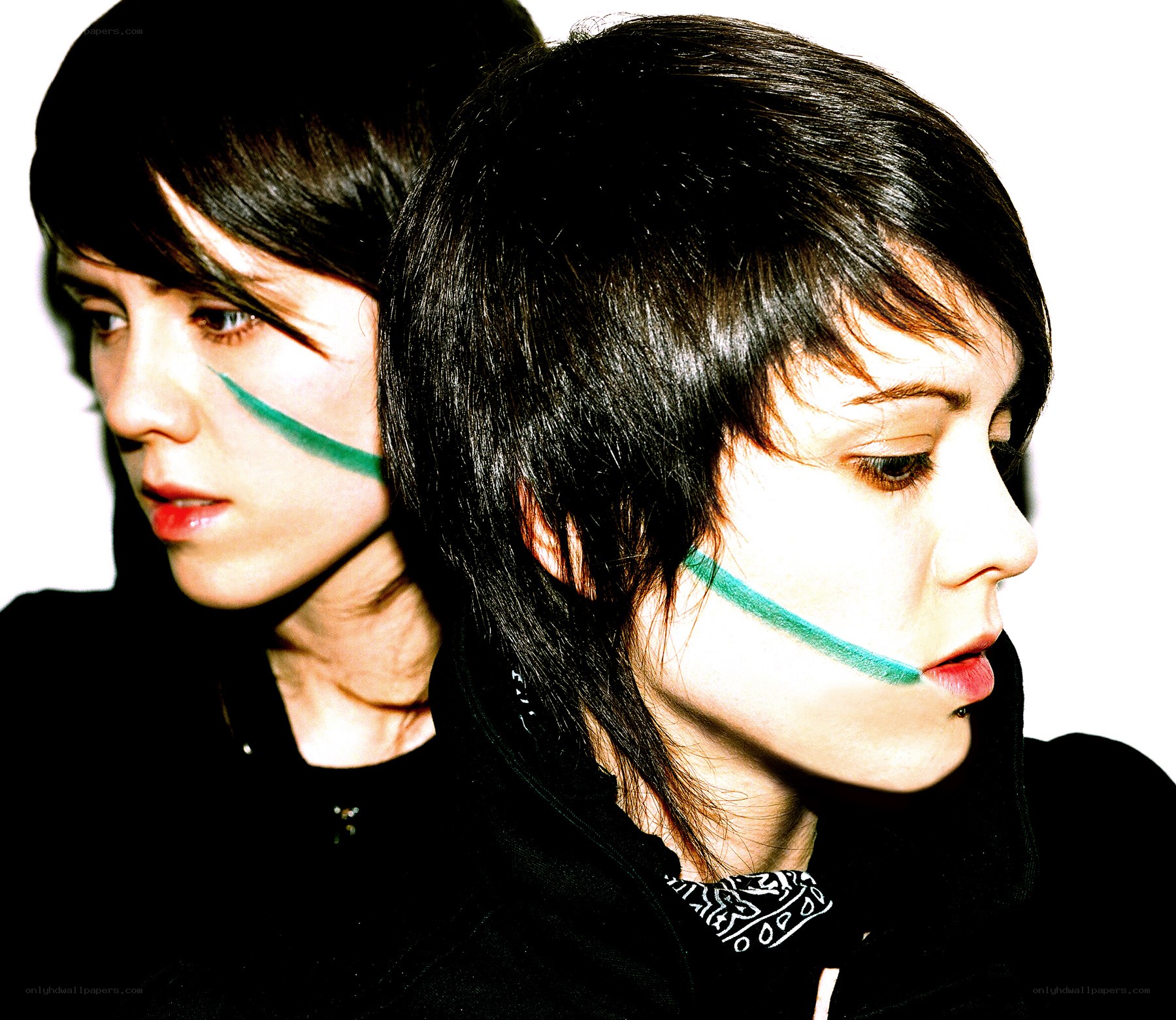 two people with green face paint