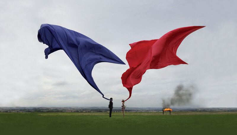 Two people with large flags