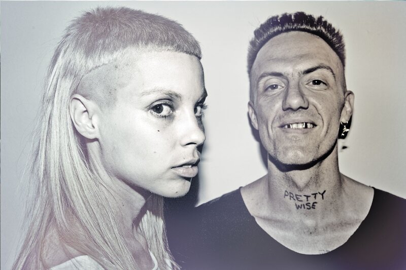 Two people with shaved heads