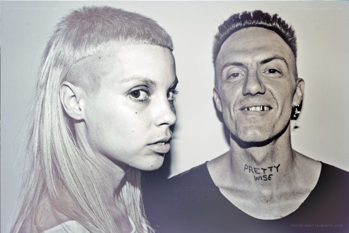 Two people with shaved heads