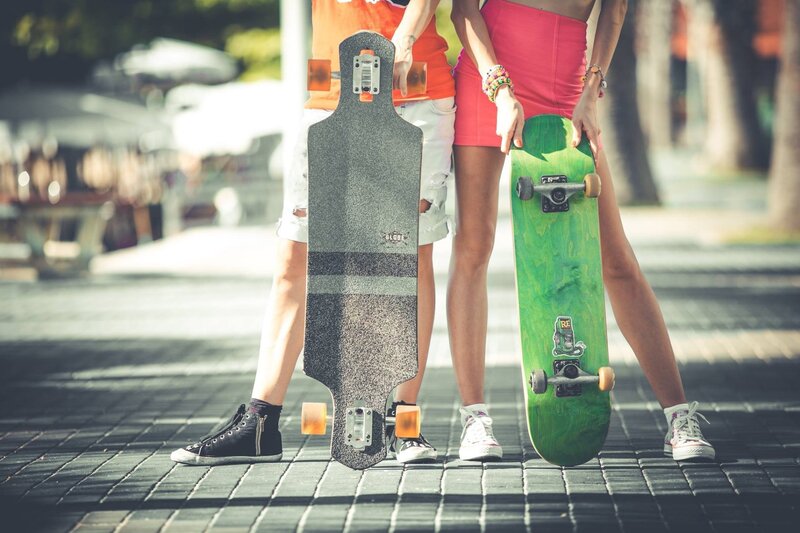 Two People with Skateboards — Green
