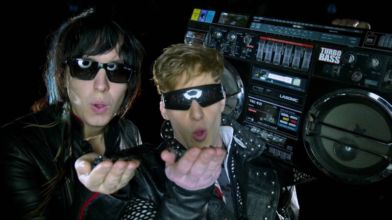 two people with sunglasses and boombox