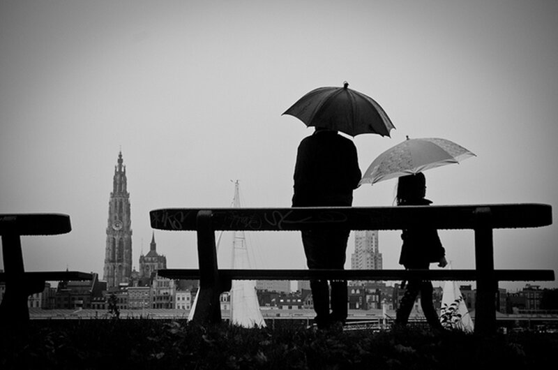 Two People with Umbrellas — Black