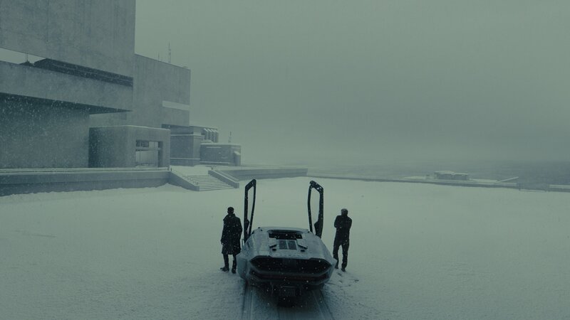 Two People with Vehicle in Snow