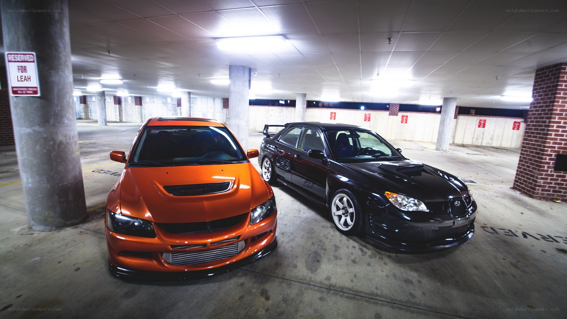 Two performance cars in a garage