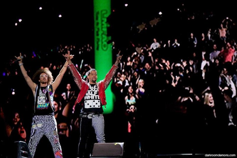 Two performers on stage with crowd