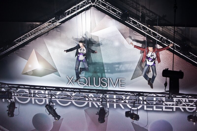 Two performers suspended on stage