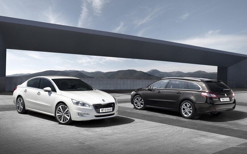 Two Peugeot cars on display
