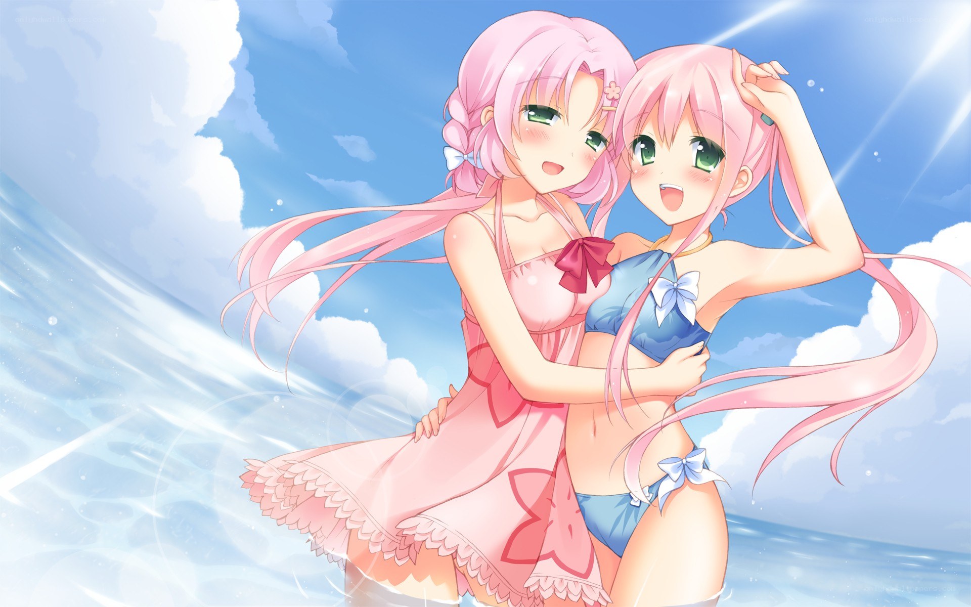 Two pink-haired girls at the beach