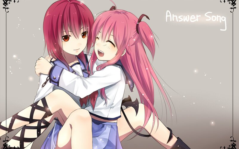 Two pink-haired girls hugging