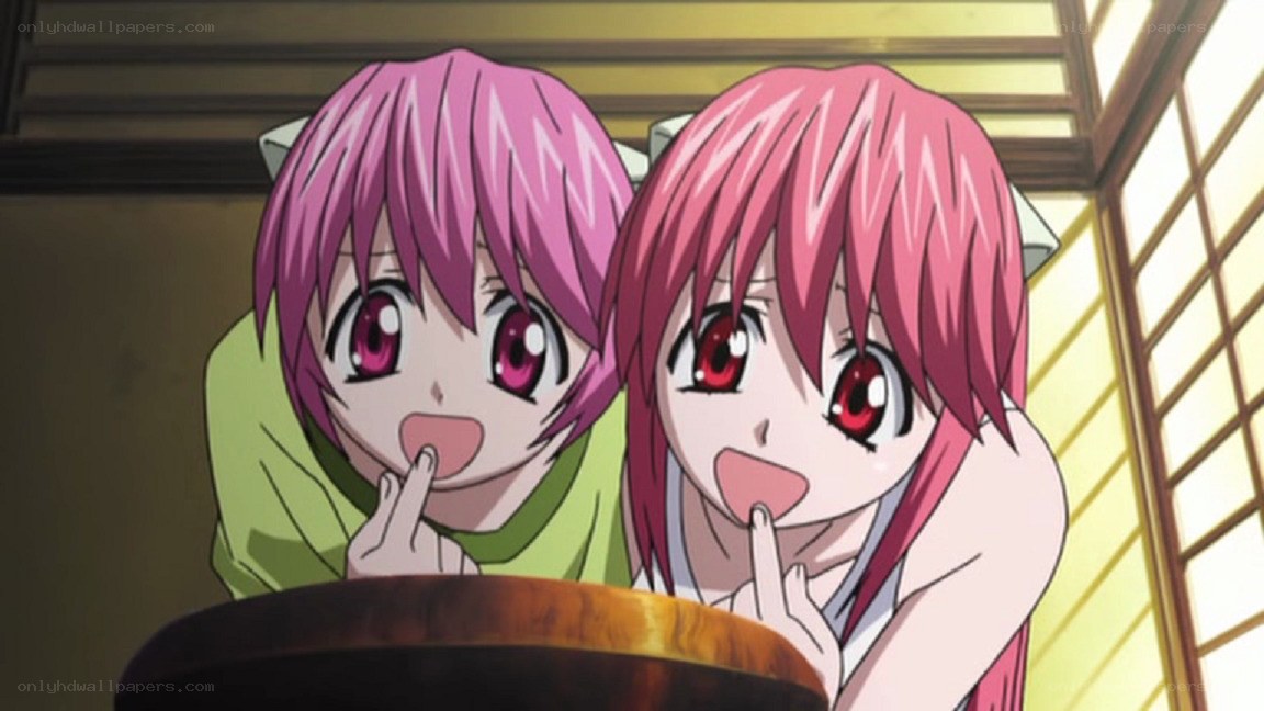 two pink-haired girls in a room