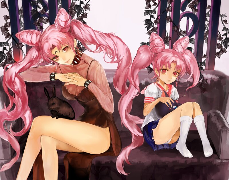 Two pink-haired girls on a couch