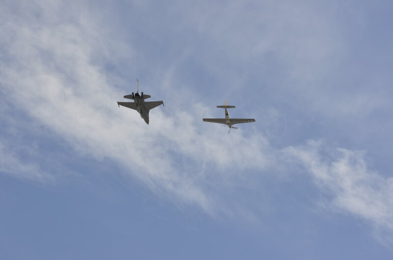 Two planes flying in the sky