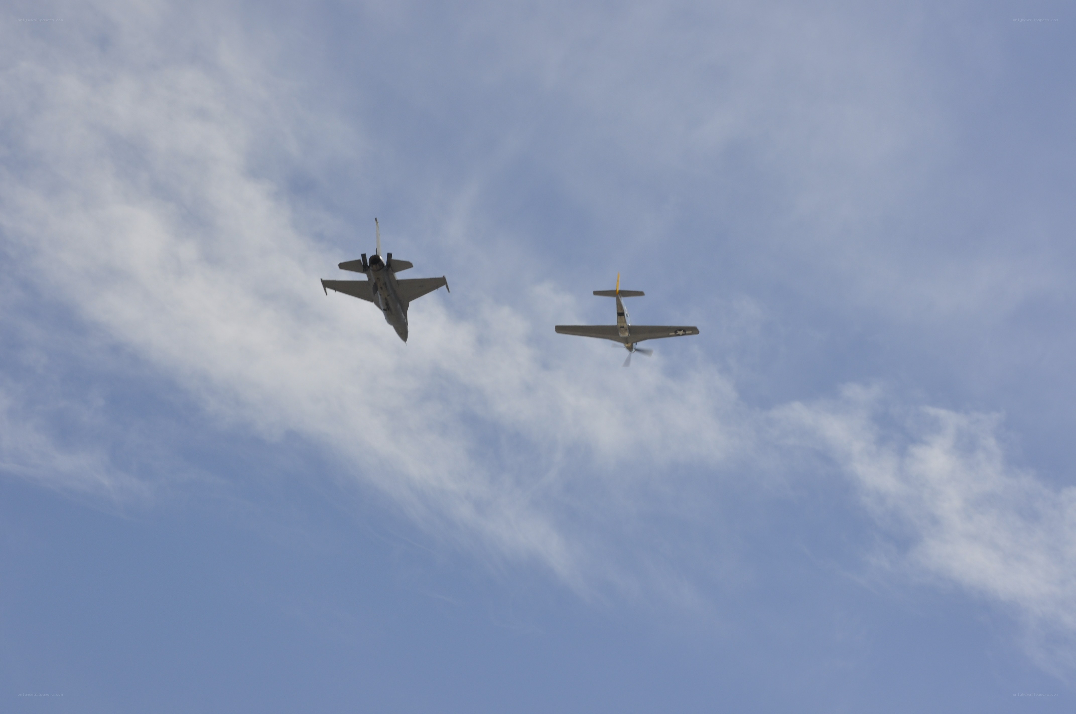 Two planes flying in the sky
