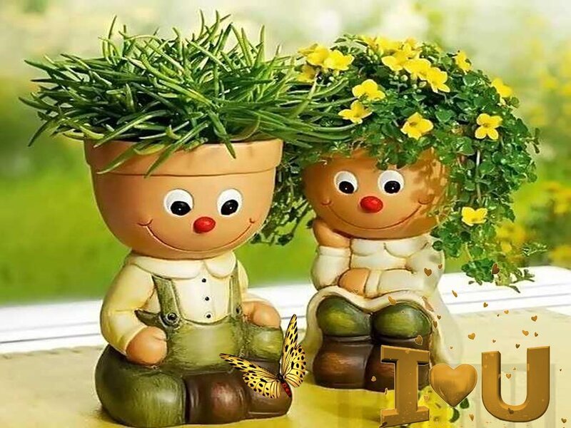 Two Plant Pots Shaped Like Children