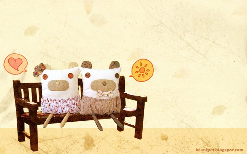 Two plush bears on a bench
