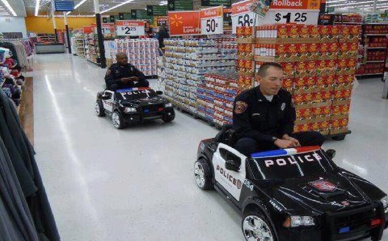 Two Police Officers in Toy Cars