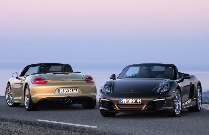 Two Porsche Boxster cars on road