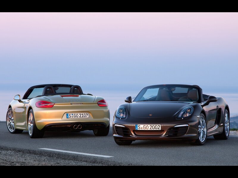 Two Porsche Boxster cars on road
