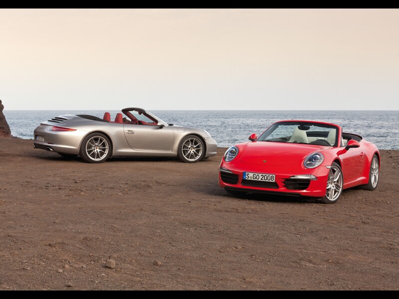 Two Porsche convertibles by the sea
