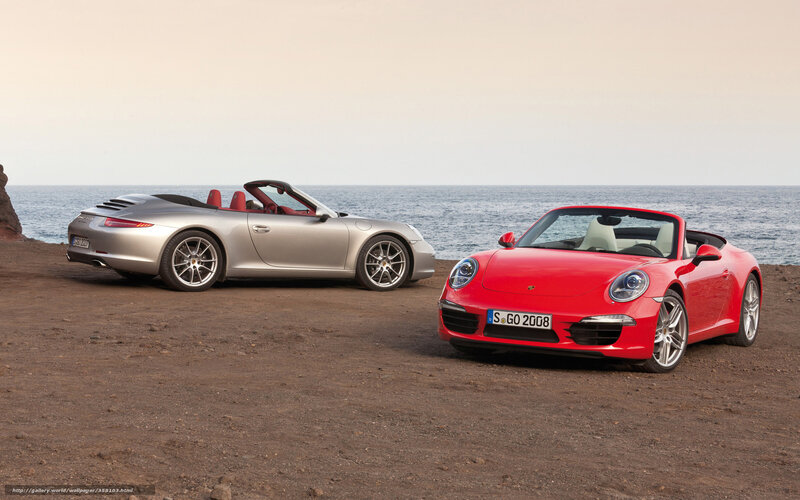 Two Porsche convertibles by the sea