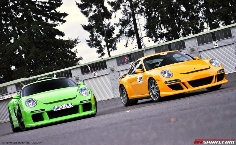 Two Porsche race cars on track