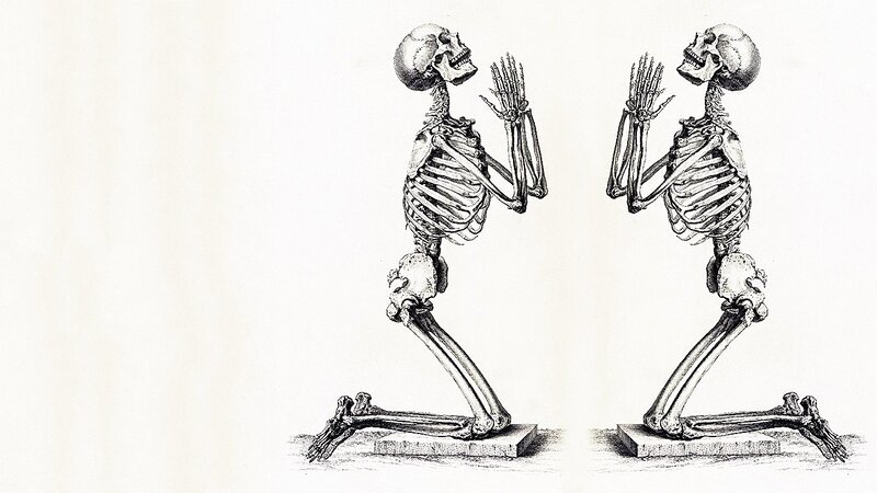 two praying skeletons