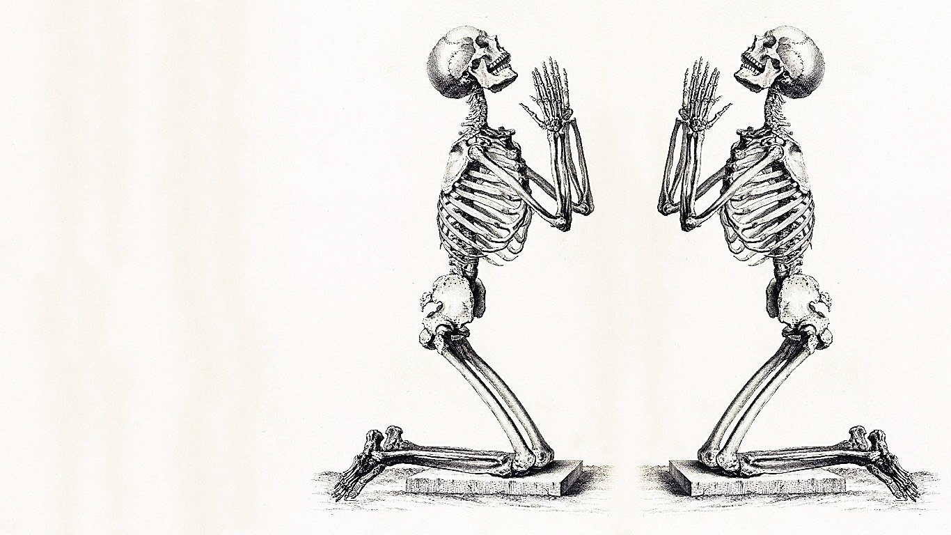 two praying skeletons