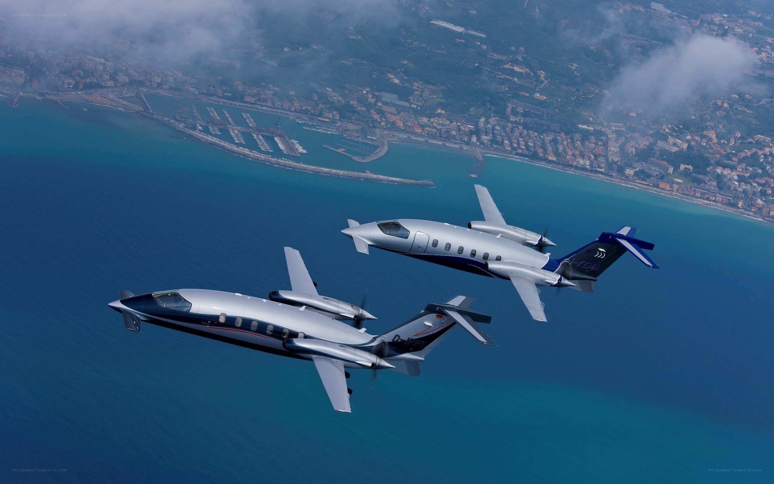 Two private jets over the coast
