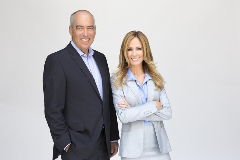 two professionals posing together