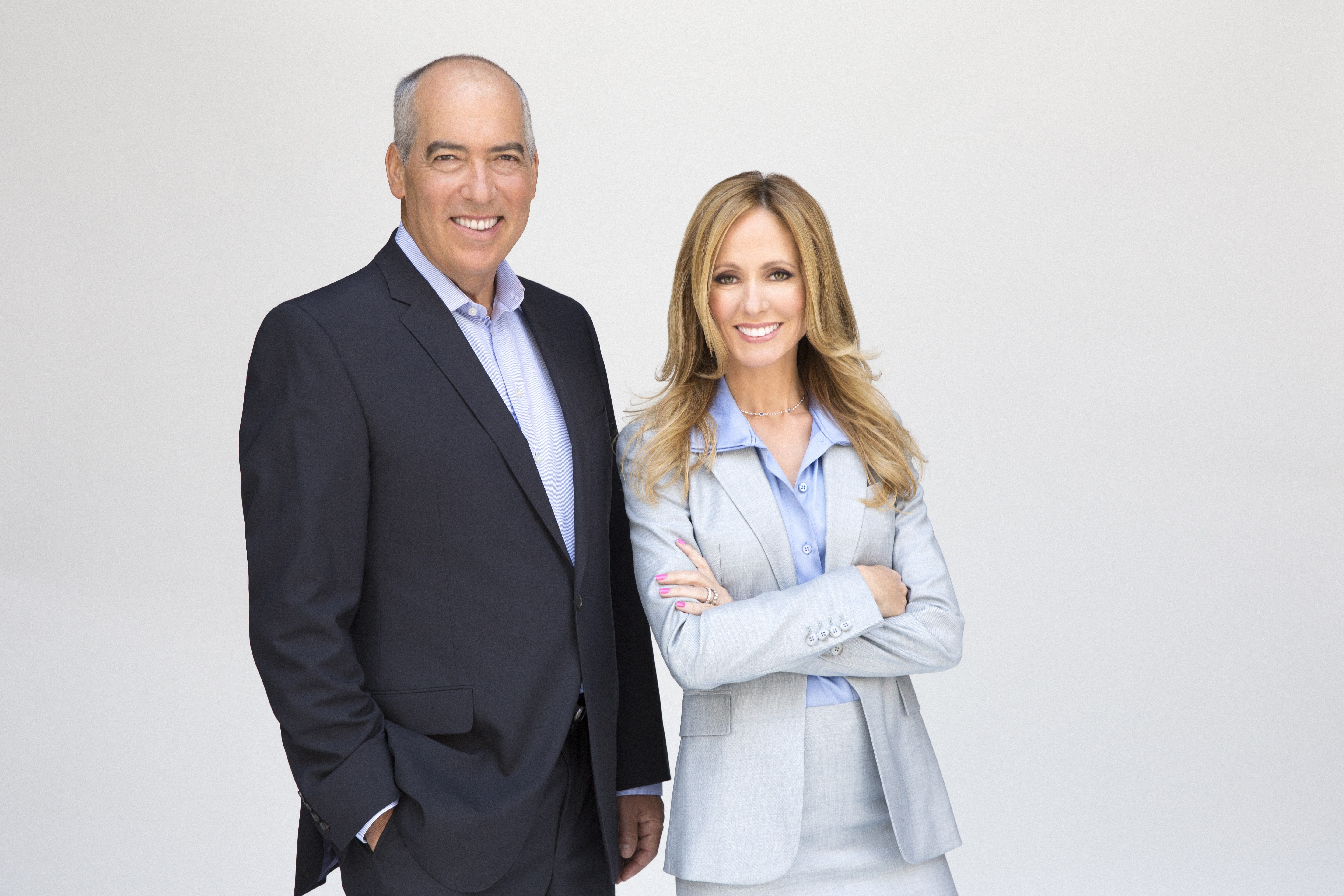 two professionals posing together