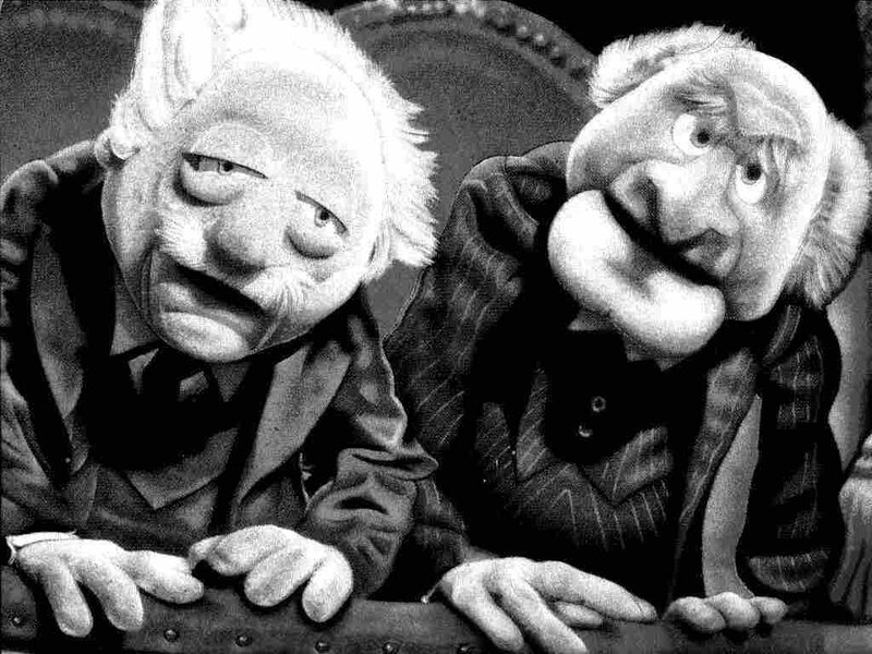 Two puppet characters in black and white