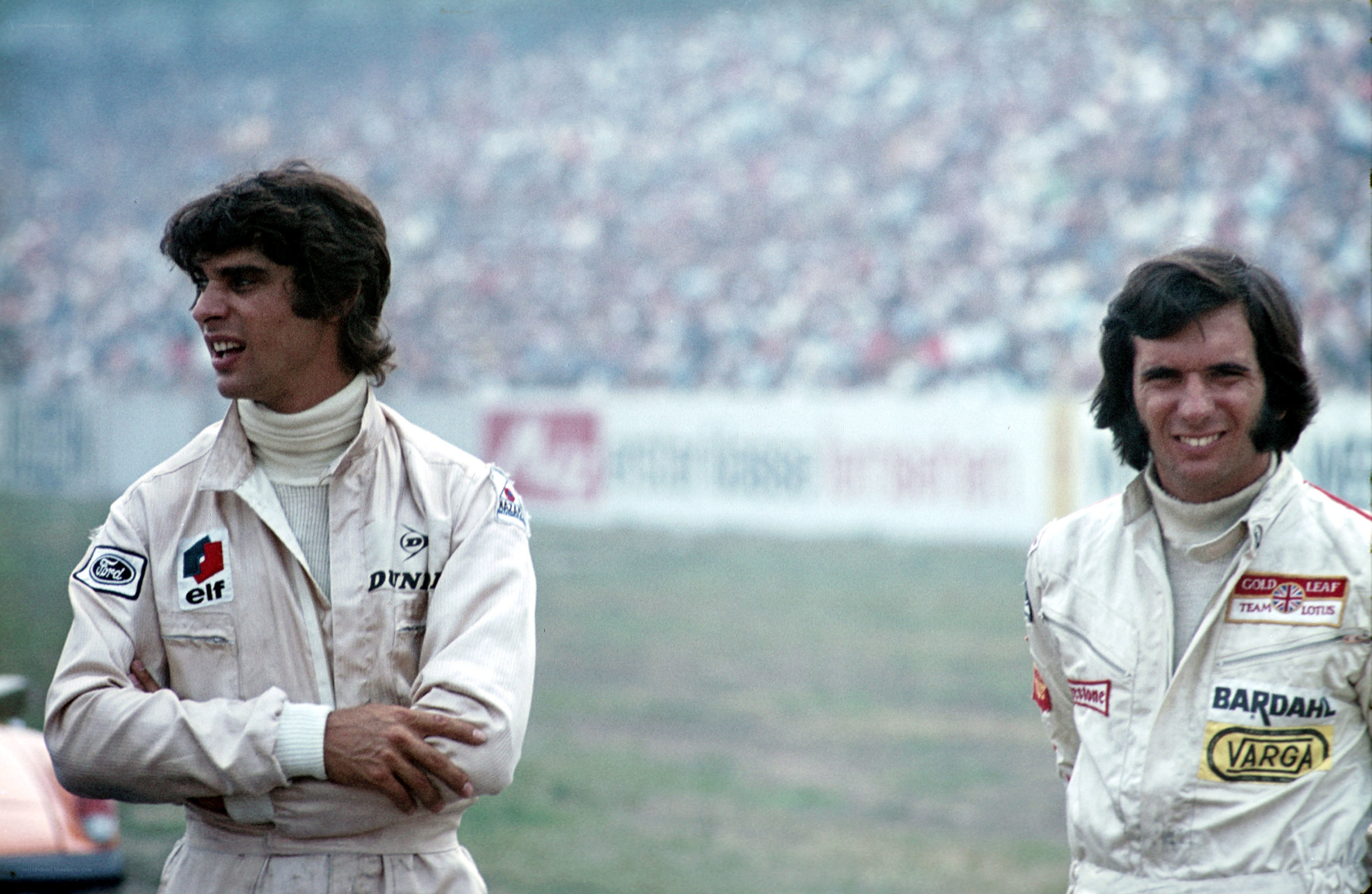 Two race car drivers at a track