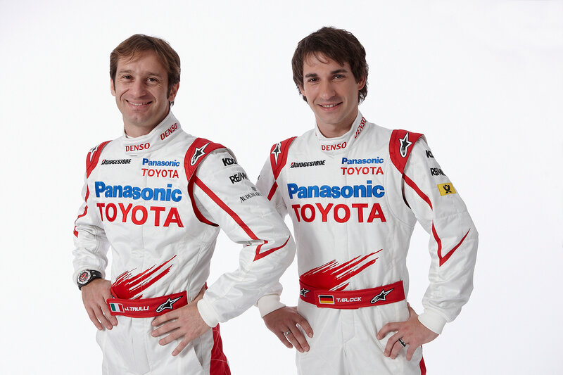 Two race car drivers in suits