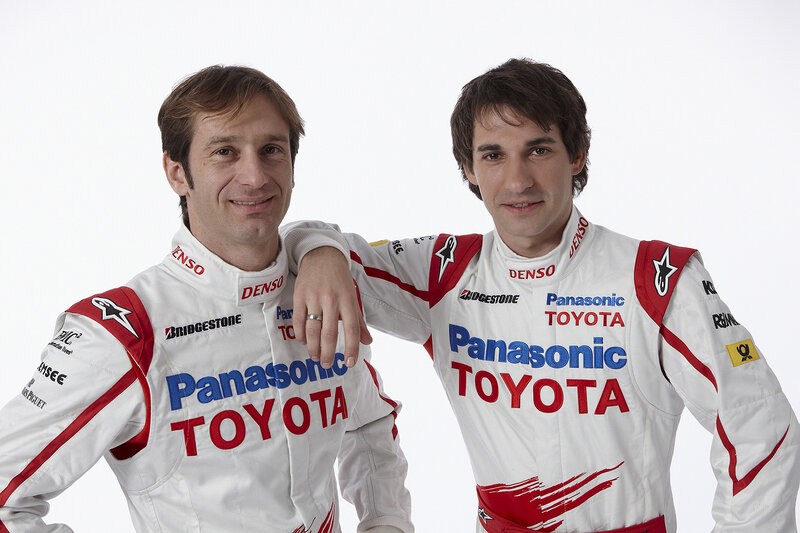 Two race car drivers in uniforms