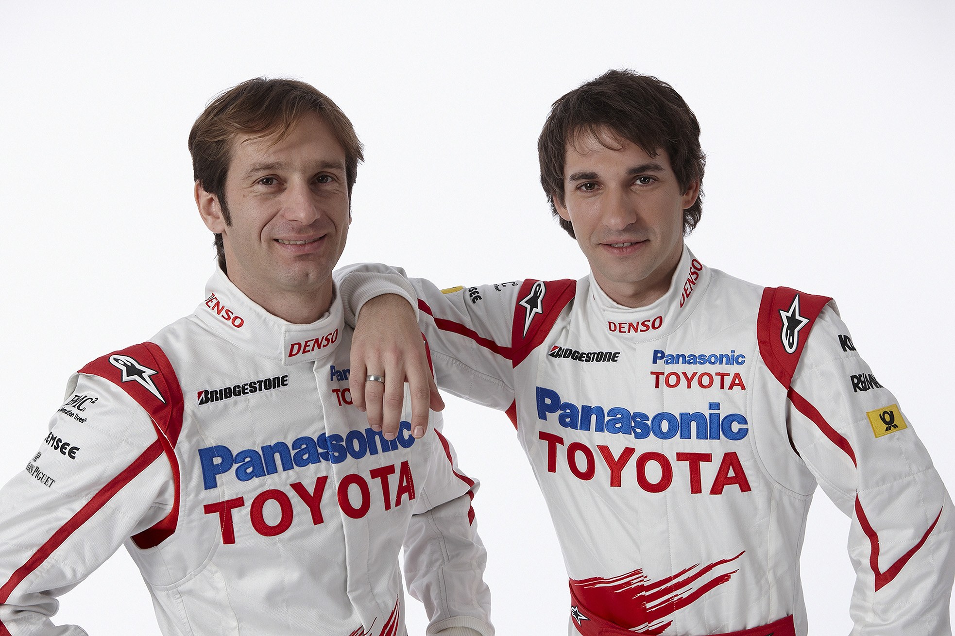 Two race car drivers in uniforms